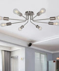 Mid Century 8 Light Chandelier in Brushed Nickel mounted on ceiling in modern living room, semi flush design