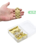 Top Tier 4 Piece Solid Brass Butler Tray Hinges That Flip Smooth And Hold Fast For Folding Tables And Sewing Machine Stands Heavy Duty Rust Resistant Furniture Hardware Kit With Screws in hand.
