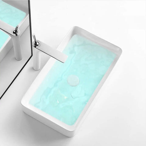 24 Inch Countertop Vessel Sink For Bathroom, Modern Rectangular White Ceramic Basin, Above Counter Design with water inside