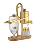 Top Shelf Belgian Siphon Coffee Maker With Stunning Gold Finish Built From Heavy Glass And Steel Frame uses gravity to brew.