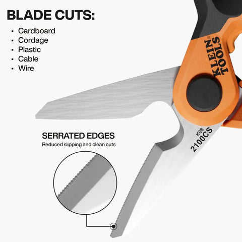 Close-up of stainless steel electrician scissors with serrated blade and built in data cable stripper, highlighting cutting ability.
