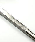 Close-up of carbide wood lathe turning tool, 90-detailer, full-size, stainless steel, unhandled