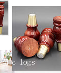 Heavy Duty Solid Hardwood Furniture Legs Nine Point Eight Inch Couch Risers and Table Boosters, dark wood, with metal casings.