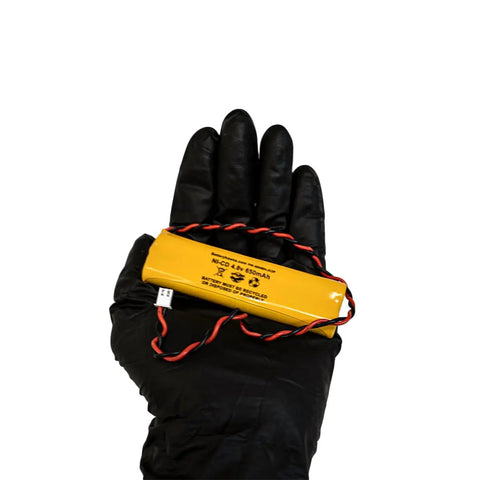 Hand holding Five Pack Ni Cad AA 650mAh Rechargeable Battery Pack For Exit Signs And Emergency Lights 4.8V All Fit E1021R