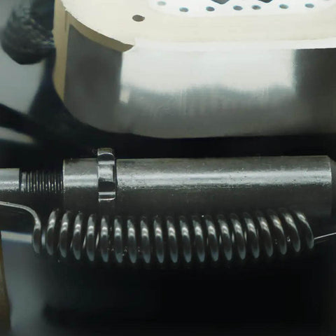Close-up of 12x2 Inch Electric Trailer Brake Magnet Kit For 5200 To 7000 Lbs Dexter Type Replacement with coil spring detail.