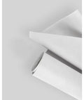 Straight Up Heavy Duty Polyethylene Waterproof Membrane Roll For Roofing Felt Underlayment rolled and partially unrolled on a grey surface.