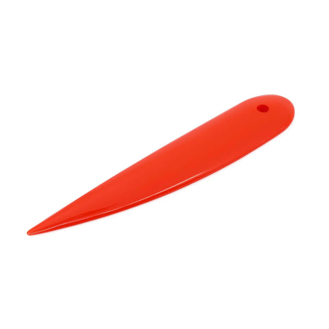 Orange seam creaser and point turner for sewing, lightweight tool to turn points, create crisp seams, and guide fabric stitching.