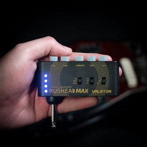 USB Rechargeable Portable Pocket Guitar And Bass Headphone Amp With Plug In Multi Effects held in hand