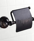 Oil Rubbed Bronze Toilet Paper Holder With Cover, brass tissue roll holder with floral design, mounted on tiled bathroom wall.