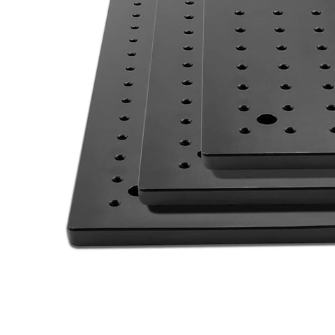 Stack of high accuracy optical breadboard plates with M6 tapped holes, 150 x 150 mm, black anodized aluminum 6061.