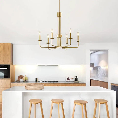 Shiny Gold 6 Light Candle Chandelier For Dining Room Living Room Kitchen And Foyer Over Table Ceiling Light Fixture 28 Inch E12 Bulb Compatible Modern Vintage Style That Really Pops Any Space hanging in a modern kitchen.