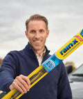 Man holding WeatherBeater Wiper Blades 26 Inch And 18 Inch Two Pack, featuring durable natural rubber blades in packaging