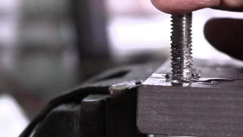 M32 X 2 Pro Grade High Speed Steel Plug Tap For Through Holes creating threads in metal sheet, close-up view