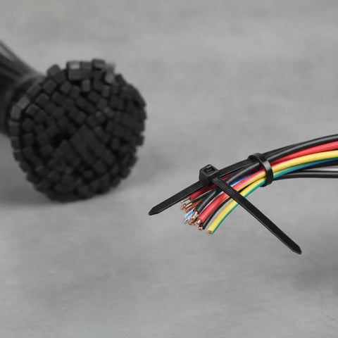 Heavy Duty Self Locking Zip Ties Provide A Rock Solid Nylon Cable Wrap Setup For Electricians With Assorted Sizes In A 100 Piece Fire Resistant Pack securing multiple colorful wires.