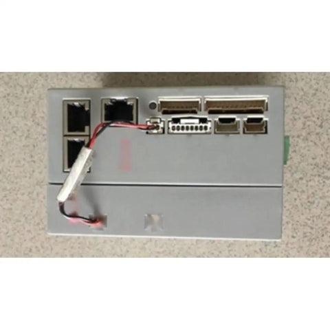 Used Industrial Motion Controller 6 230 3 For Precise Motor Control In Automation Systems Reliable Servo And Stepper Drive Plug And Play Module For CNC And Robotics Great Value And Quick Deployment. Grey used BAS-6/230-3 motion controller with wired ports.