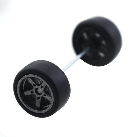 Close-up of a wheel from the Eight Piece Toy Car Wheel Set with 10mm rubber tires and metal axle, durable and smooth rolling for DIY projects.