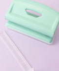 Mint 2 Hole Puncher With Waste Tray, 10 Sheet Capacity, Metal Puncher With Adjustable Guide on purple background