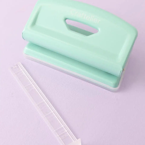 Mint 2 Hole Puncher With Waste Tray, 10 Sheet Capacity, Metal Puncher With Adjustable Guide on purple background