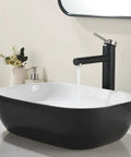18x13 Inch Black Vessel Sink For Bathroom, Oval Ceramic Basin with Durable Glossy Finish on white countertop