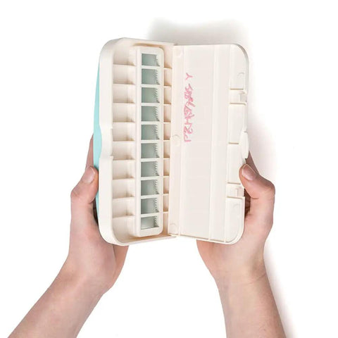 Hands holding open Word Punch Board For Scrapbooking And Card Making Dope Letter Punch Set with 26 letters and space saving design