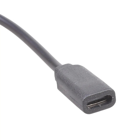 Close-up of No Stress Type C Extension Cable With Right Angle Plug Fits Snug In Tight Corners For Marathon Gaming And Daily Grind Delivers Smooth 5V 2A Power Without Data Sync Hassle, black connector.