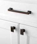 Stepped Bar Cabinet Pull in Oil Rubbed Bronze, 5 Inch Screw Spacing, 25 Pack on white kitchen cabinet