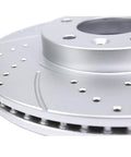 Close-up of front drilled and slotted brake rotor in the kit for Toyota Sienna Highlander RX350 RX450h NX200T NX300 NX300h replacement.