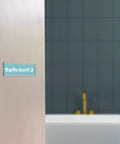Clear Acrylic Wall Name Plate Holders 15 Pack 2 X 8 Inches With Adhesive Tape And 50 Double Sided Foam Tapes mounted on bathroom door