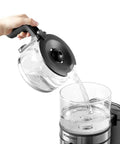 Pouring water into Stainless Steel Automatic Drip Coffee Maker For Home And Office, Giant 1250ml Capacity Brews 5 To 10 Cups.