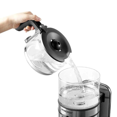 Pouring water into Stainless Steel Automatic Drip Coffee Maker For Home And Office, Giant 1250ml Capacity Brews 5 To 10 Cups.