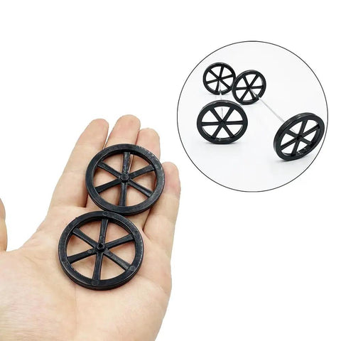 10Pcs 44Mm Model Toy Wheel Set With 5Pcs Shafts And Round Rod Axles for DIY RC Cars, black wheels held in hand