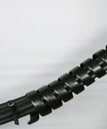 Person installing Go-To Safe-Spiral Pre-Cut Spiral Wrap For Hoses And Cables Black HD-PE 0.50 Inch OD By 25 Foot Pre-Cut Length on cables