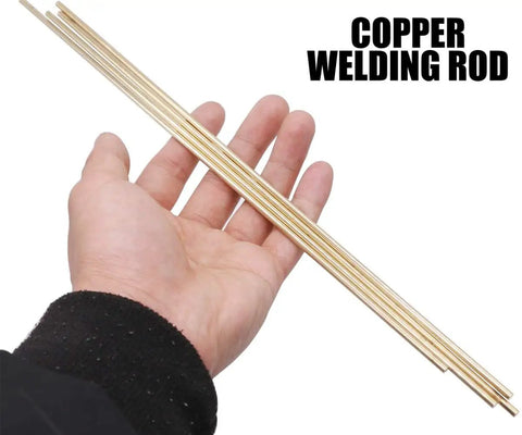 Hand holding Eight Piece Solid Brass Rod Set Four Millimeter Five Thirty Second Inch Diameter Twelve Inch Long Lathe Bar Stock Kit