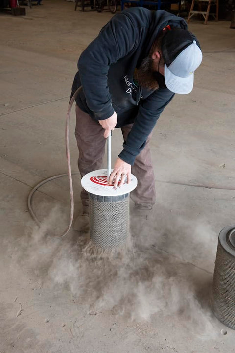 Man using Air Filter Cleaner Heavy Duty Rotating End For Quick Clean Up, Cleans Most Filters In Under One Minute, Made In USA.