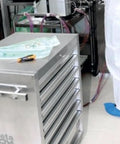 Rock Solid Stainless Steel Mobile Roller Cabinet With Seven Drawers Shop Tool Storage Workbench in an industrial setting.