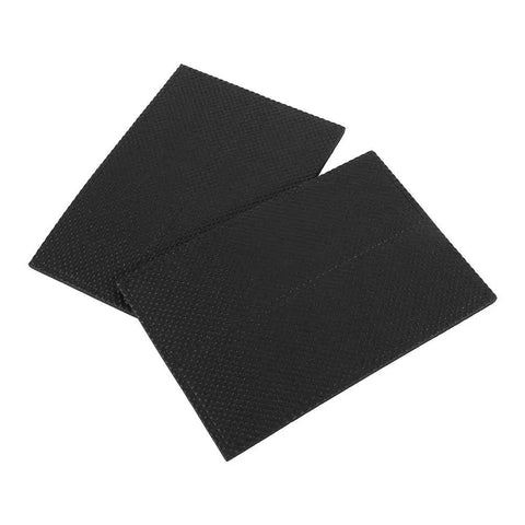 Close-up of 4-pack black self adhesive rubber floor protector pads for furniture, 0.4 cm thick 4.3 x 14 cm, shields floors from scratches.