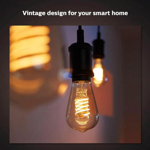 Smart 60W ST19 Filament LED Bulb 2 Pack Soft Warm White 550LM E26 Indoor Lighting glowing in a fixture