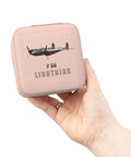 Hand holding Lightning Aircraft Pink Jewelry Travel Case For Women, compact square organizer with P-38 Lightning design.