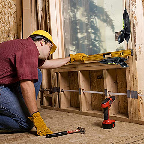 Air shim inflatable pry bar and leveling tool; yellow tool used to align wooden studs.