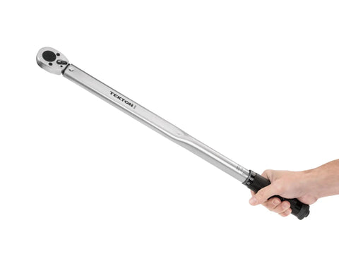 Hand holding Half Inch Drive Micrometer Torque Wrench With 25 To 250 Foot Pound Range, showing reversible ratchet and scale