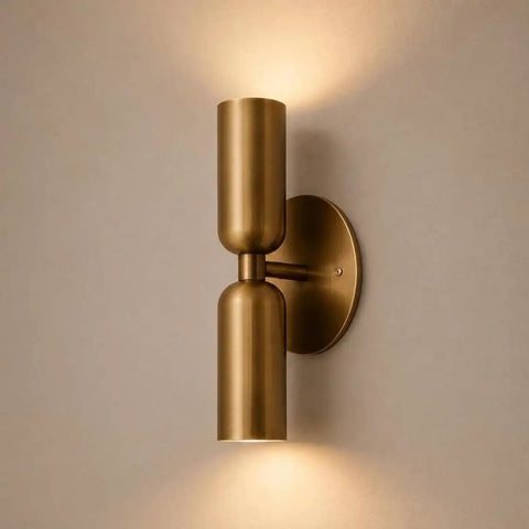 Modern Brass Wall Sconce – Mid Century Cylinder Up and Down Wall Light, minimalist design with brushed brass finish, mounted on wall.