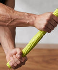 Wrist Strength Trainer Twist Bar For Real Grip Gains And Arm Power, durable green rubber hand grip tool in use