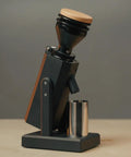 Dope Stepless Coffee Grinder Featuring 40mm Stainless Steel Conical Burrs For Pulling Consistent Espresso Shots And Brewing Smooth Daily Drips With Hella Low Retention In Matte Black, side profile view.