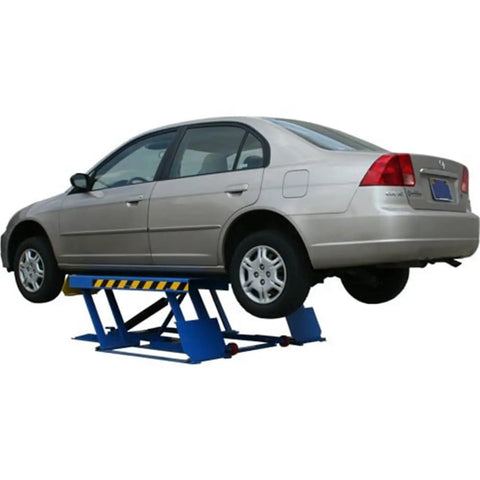 Badass Low Rise Scissors Vehicle Lift with sedan raised, showcasing heavy-duty steel frame and quick release safety locks.