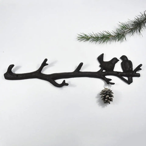 Vintage Cast Iron Tree Branch Coat Hook For Walls And Entryways Bringing Dope Rustic Vibes And Straightforward Storage Solutions That Honestly Upgrade Your Home Decor Setup featuring bird accents.