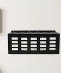 Heavy Duty Wall Mount Caulk Tube Holder Rack Holds Eleven Adhesive Cartridges Upright Locks Secure on wall, black metal design.