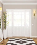One Light Wall Sconce In Polished Nickel Finish, Transitional Coastal Traditional Modern Style For Bathroom, Hallway, Or Bedroom, Ambient Lighting Fixture With Sleek, Upscale Look illuminating an elegant entryway with a mirror and decor.