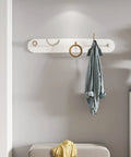 Heavy Duty Wrought Iron Wall Coat Hooks With Zero Hassle Setup For Bedroom And Entryway Modern Five Arm Rack holding a blue coat.