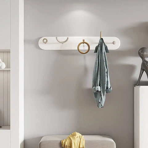 Heavy Duty Wrought Iron Wall Coat Hooks With Zero Hassle Setup For Bedroom And Entryway Modern Five Arm Rack holding a blue coat.