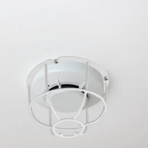 Built Damn Tough Fire Sprinkler Head Protector Wire Cage Guard For Ceiling Mount Installations in white steel, mounted on ceiling.